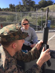 Jane Wayne Day military spouse receives weapon safety instruction on Jane Wayne Day