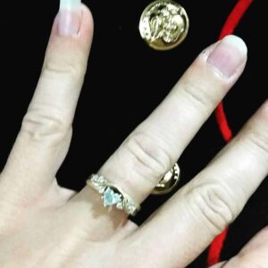 stranded in the desert Marine Corps dress blues and hand with wedding ring; symbols of a military marriage