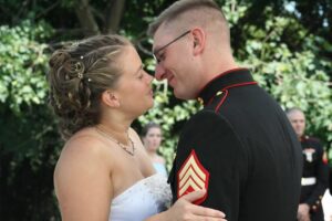 military wedding bride and groom celebrate after planning a military wedding